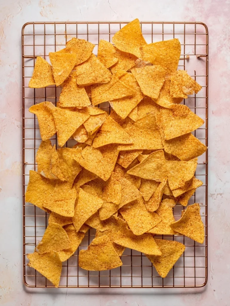 Crispy homemade tortilla chips cooling on a wire rack after air frying