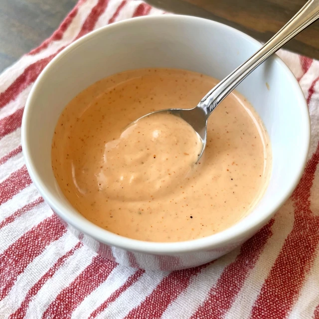 Creamy Big Mac Sauce copycat in a white bowl with a spoon