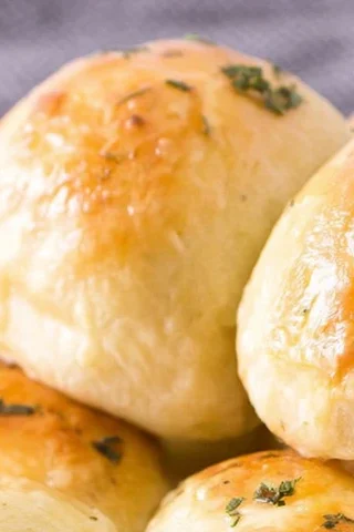 Garlic Butter Cheese Bombs with melted cheese pull and golden buttery tops