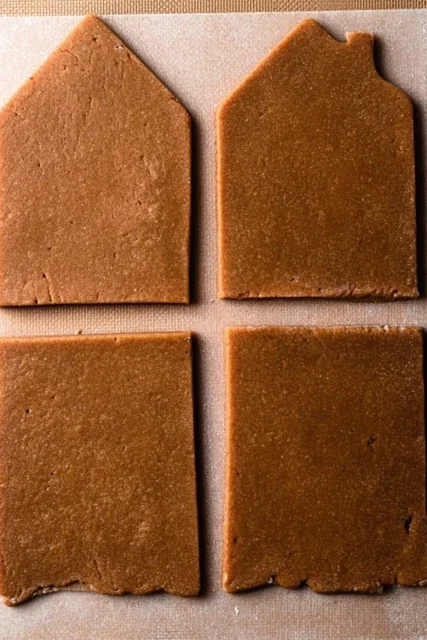 Cut gingerbread house wall pieces ready for baking