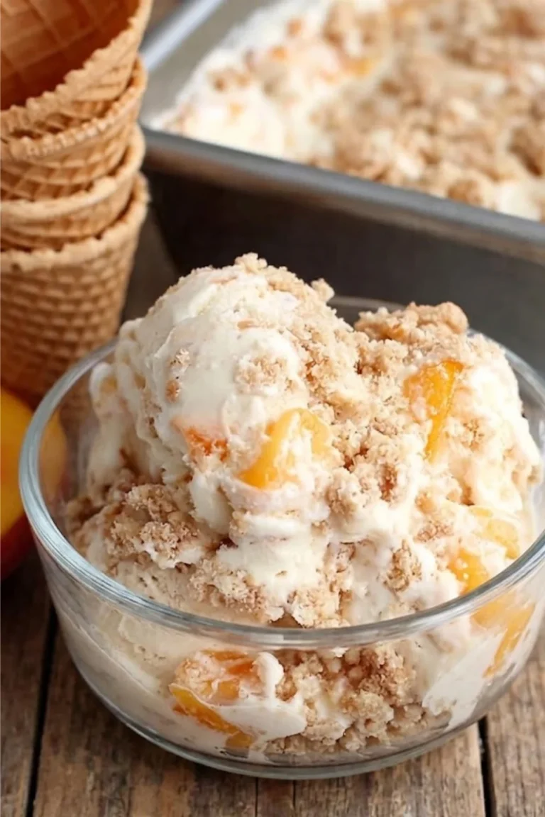 A bowl of Peach Pie Ice Cream sitting next to a stack of empty waffle cones on a rustic wooden surface.