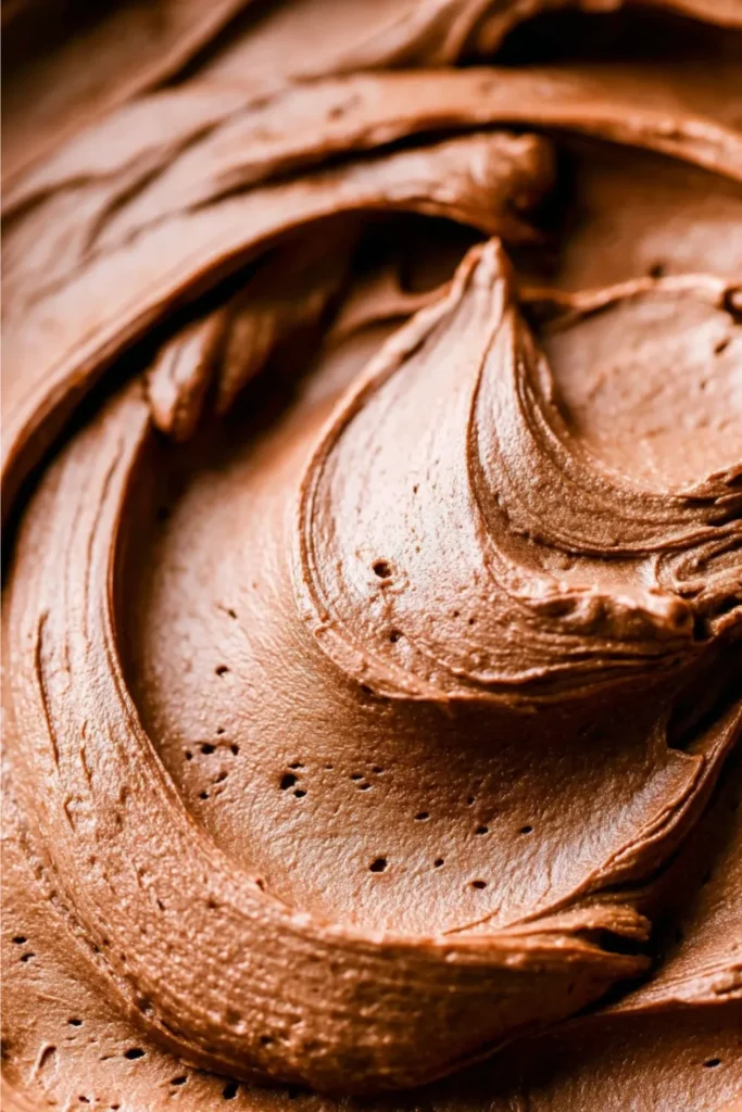 close-up of the velvety, aerated texture of homemade Nutella frosting.